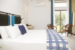 Ένα ή περισσότερα κρεβάτια σε δωμάτιο στο Airport Retreat-CMB Transit Stay