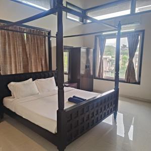 Ένα ή περισσότερα κρεβάτια σε δωμάτιο στο Mansarovar Bungalows