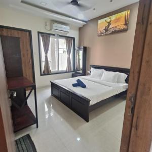 Ένα ή περισσότερα κρεβάτια σε δωμάτιο στο Mansarovar Bungalows