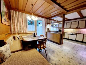 a room with a kitchen with a table in it at Haus Daheim in Sankt Leonhard im Pitztal