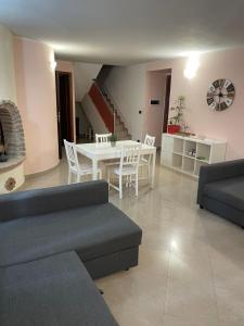 a living room with a couch and a table at Ca’ Vanello in Borgo Tossignano