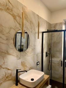 a bathroom with a sink and a shower at Casa Amore Design - South Sardinia - in San Gavino Monreale