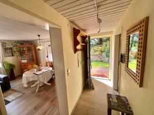 a living room with a table and a dining room at Ferienhaus Robin in Titisee-Neustadt