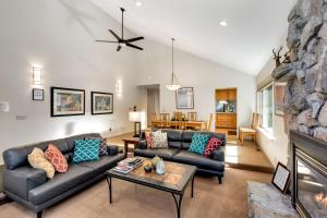 a living room with a couch and a fireplace at Spacious Riverfront home in Nebelhorn +14 photos