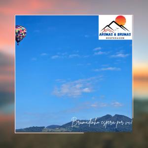 ein Bild von einem Fallschirm am Himmel in der Unterkunft Aromas e Brumas hospedagem in Brumadinho