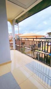 a balcony with a view of the ocean at Mike's HOUSE in Yaoundé