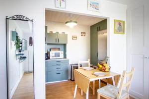 Kuchyň nebo kuchyňský kout v ubytování Face à la Seine - Charmant studio proche Centre