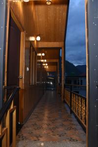 a hallway on the balcony of a building at Shivanchal Homestay & Cottage in Uttarkāshi