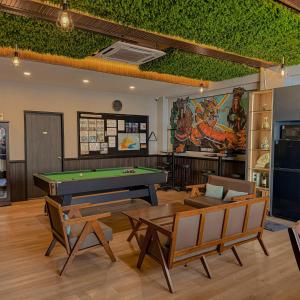 a billiard room with a pool table in it at Concrete Jungle Cabin in Kota Kinabalu