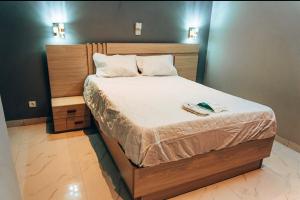 Ένα ή περισσότερα κρεβάτια σε δωμάτιο στο Les Résidences Davina Hope