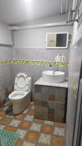 Koupelna v ubytování ทุ่งเศรษฐีโฮมสเตย์แอนด์คาเฟ่