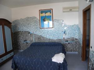 Кровать или кровати в номере Azzurromare Residence