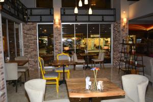 a restaurant with tables and chairs in a room at The Marmaris Boutique Hotel in Marmaris