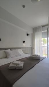 Postel nebo postele na pokoji v ubytování Hotel Eva