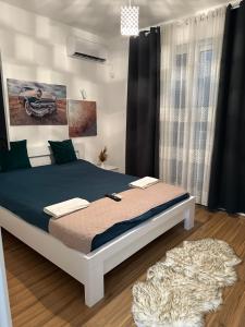 Ένα ή περισσότερα κρεβάτια σε δωμάτιο στο PrivatHomeUlcinj1 +8 φωτογραφίες