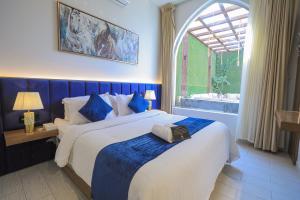 Postel nebo postele na pokoji v ubytování The Corner Hotel Resorts - Riyadh + 156 fotografií