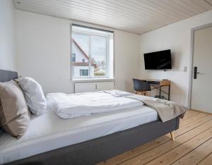 Postel nebo postele na pokoji v ubytování City Apartments