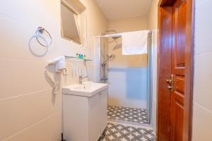 a bathroom with a sink and a shower at Oldcity homes hotel in Istanbul