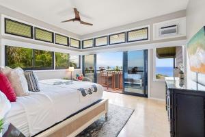 a bedroom with a bed with a view of the ocean at Kapalua Ridge Villas 311 · KRV 311 Beautiful Kapalua Villa for W in Kahana
