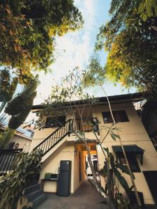 a house with a staircase leading up to a building at Tropical Project in Pai in Pai