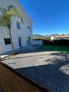 a building with a tree in front of it at 5 bedroom house, office, laundry room in Colomars