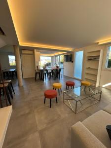 a living room with a couch and chairs and a table at 5 bedroom house, office, laundry room in Colomars +12 photos