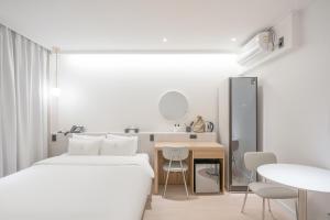 Postel nebo postele na pokoji v ubytování Hotel Yam Gumi