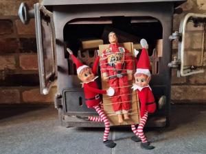 two elves are standing on the back of a van at Beresford Cottage in Skegness +60 photos