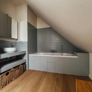 a bathroom with a sink and a bath tub at John in Étaples +49 photos