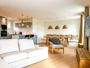 a living room with a white couch and a table at John in Étaples