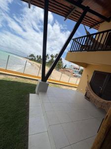 a balcony with a view of the beach at Pousada Dra Lindalva in Maragogi +25 photos