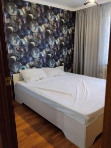 Postel nebo postele na pokoji v ubytování Двухкомнатные апартаменты на Гоголя