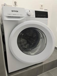 a white washing machine in a room at Rosengarten in Rosengarten