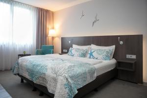 Postel nebo postele na pokoji v ubytování Elegantes Smart Apartment in Szene-Viertel