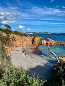 a sandy beach with rocks and the ocean at Casetta di Asciaghju in Porto-Vecchio +7 photos