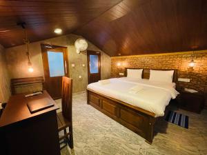 Postel nebo postele na pokoji v ubytování Alice House Hiriketiya