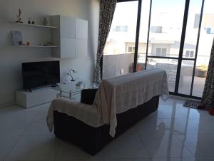 Ένα ή περισσότερα κρεβάτια σε δωμάτιο στο Cozy penthouse