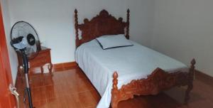 Postel nebo postele na pokoji v ubytování Hostal Villa Laurita