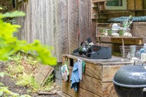 a outdoor kitchen with a stove in a garden at Beech Timber- 30 Acre Secluded Glamping in RRG in Beattyville