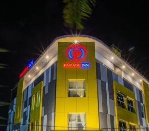 a yellow building with a panda inn sign on it at parade inn kendari in Pipulu