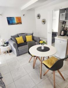 a living room with a table and a couch at Apartment Marina in Kotor +37 photos