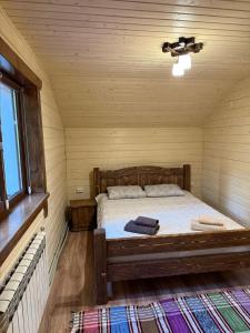 Ένα ή περισσότερα κρεβάτια σε δωμάτιο στο Гірська роса