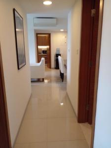 a hallway leading to a room with a living room at Gems Havelock Apartment in Colombo