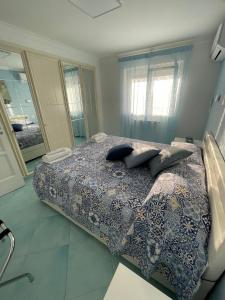 a bedroom with a bed with pillows on it at Casa Maria Grazia Camera vista mare in Anacapri