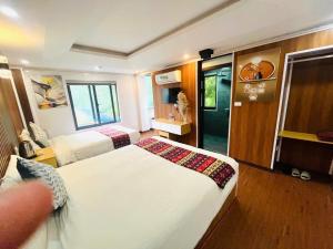 Ένα ή περισσότερα κρεβάτια σε δωμάτιο στο SaPa Camellia Hotel