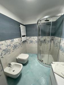 a bathroom with a toilet and a shower and a sink at Casa Maria Grazia Camera vista mare in Anacapri +19 photos