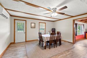 a dining room with a ceiling fan and a table with chairs at 1 600 Acres Pool Pond Hidden Treasure RRG in Stanton