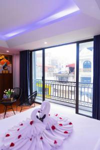 Ένα ή περισσότερα κρεβάτια σε δωμάτιο στο SaPa Camellia Hotel