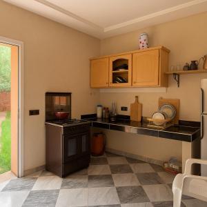 eine Küche mit Herd und Arbeitsplatte in der Unterkunft Villa d'Exception à Ourika Nichée au Cœur des Montagnes in Aghbalou