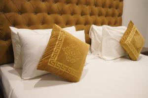 Ένα ή περισσότερα κρεβάτια σε δωμάτιο στο Grand Pearl Hotel +31 φωτογραφίες